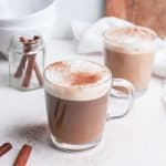 Copycat Starbucks cinnamon dolce latte in glass mug on table.