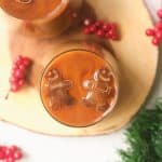 Top view of christmas iced coffee with coffee ice cubes shaped like gingerbread men.