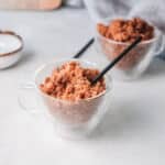 black teaspoon resting in coffee granita cup.