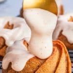 spooning glaze onto mini bundt cakes with text mini pumpkin bundt cakes.