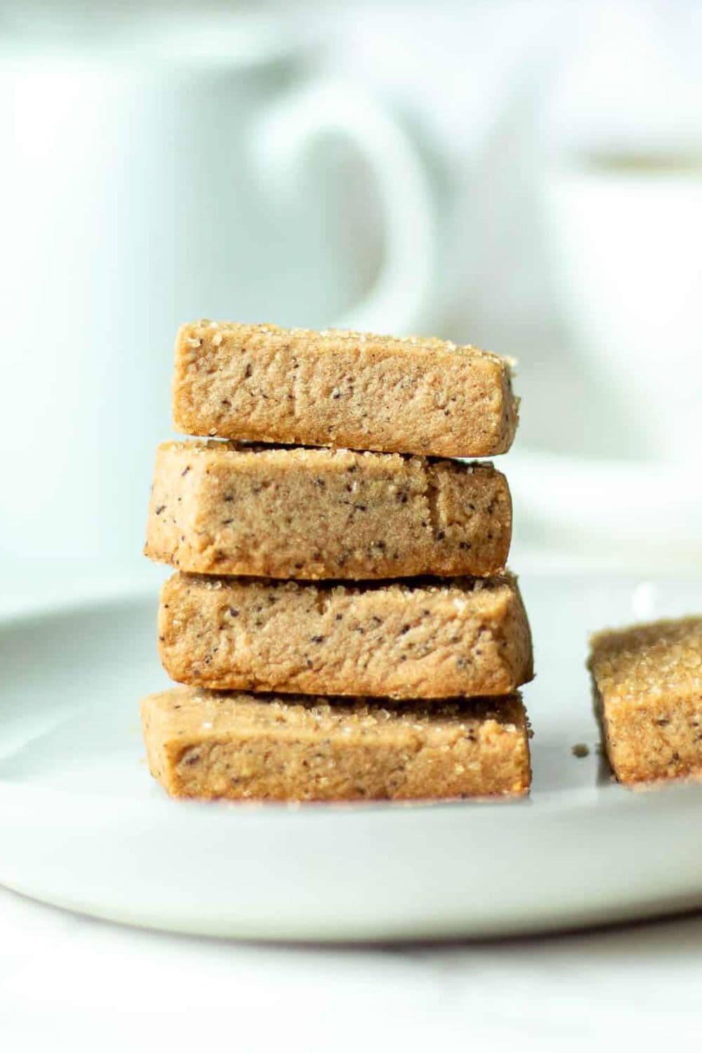 coffee flavored biscuits stacked on plate.