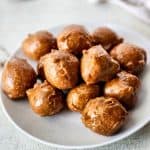 glazed coffee donut balls on plate.