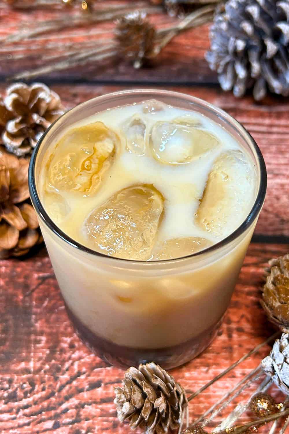 gingerbread white russian with ice in tumbler.