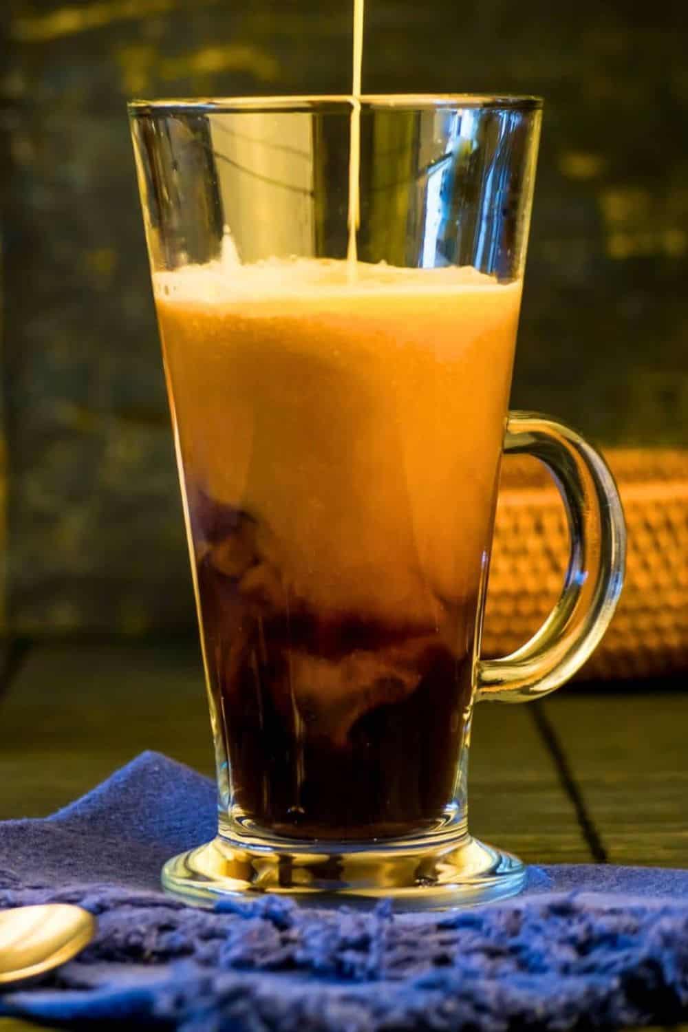 pumpkin spice coffee creamer in glass mug.