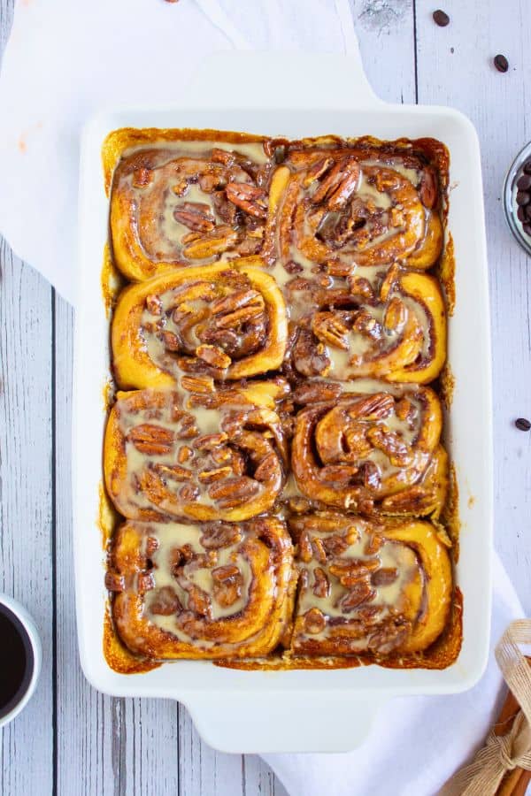 pillsbury cinnamon rolls topped with icing in tray.