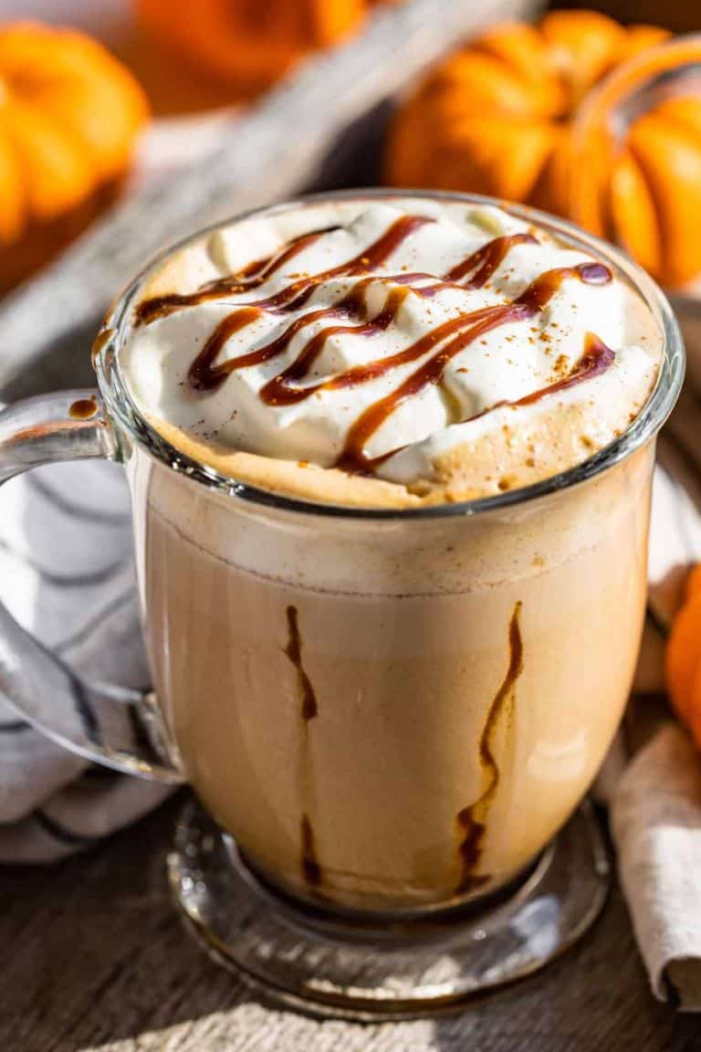 salted caramel pumpkin chai latte in glass mug.