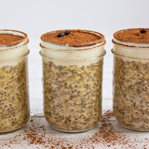 healthy tiramisu overnight oats in jars lined up.