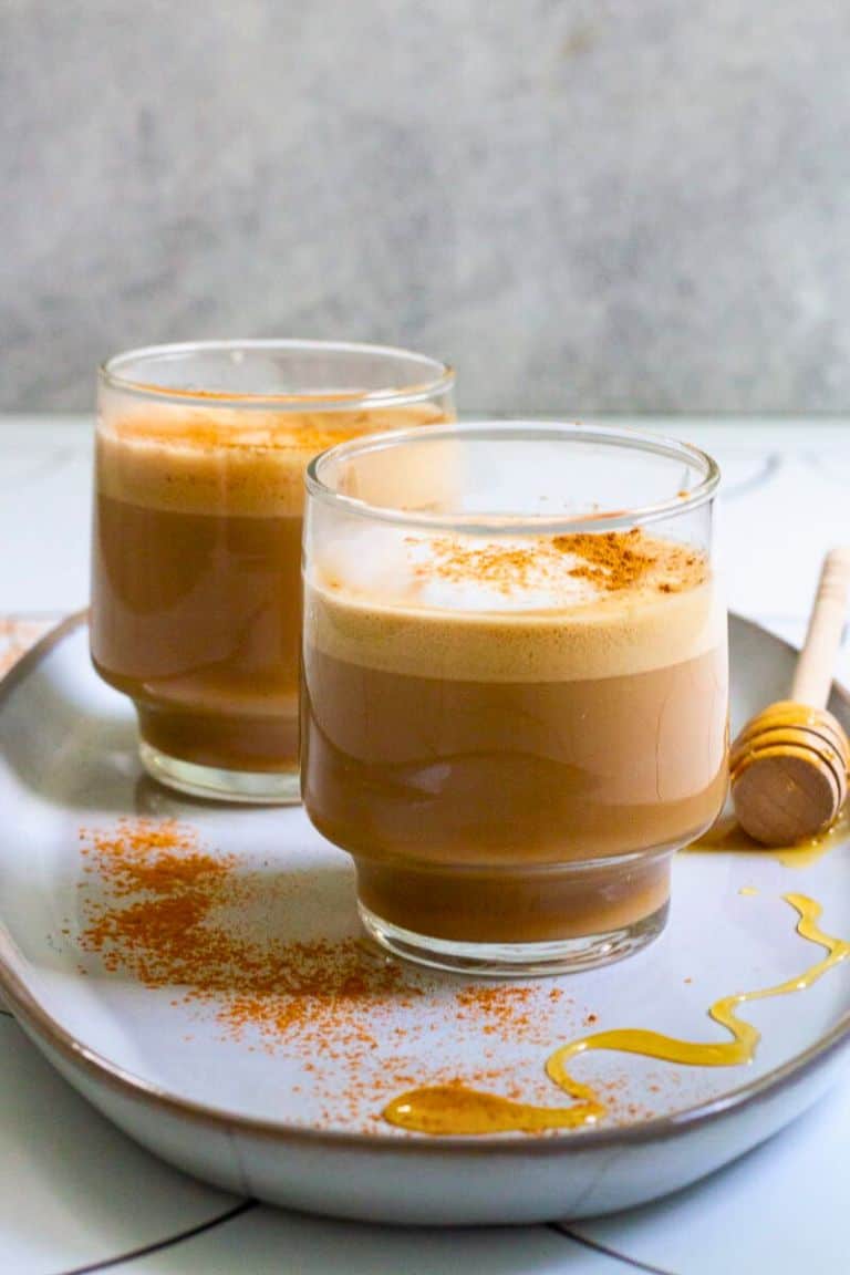 honey cinnamon latte in short glass.