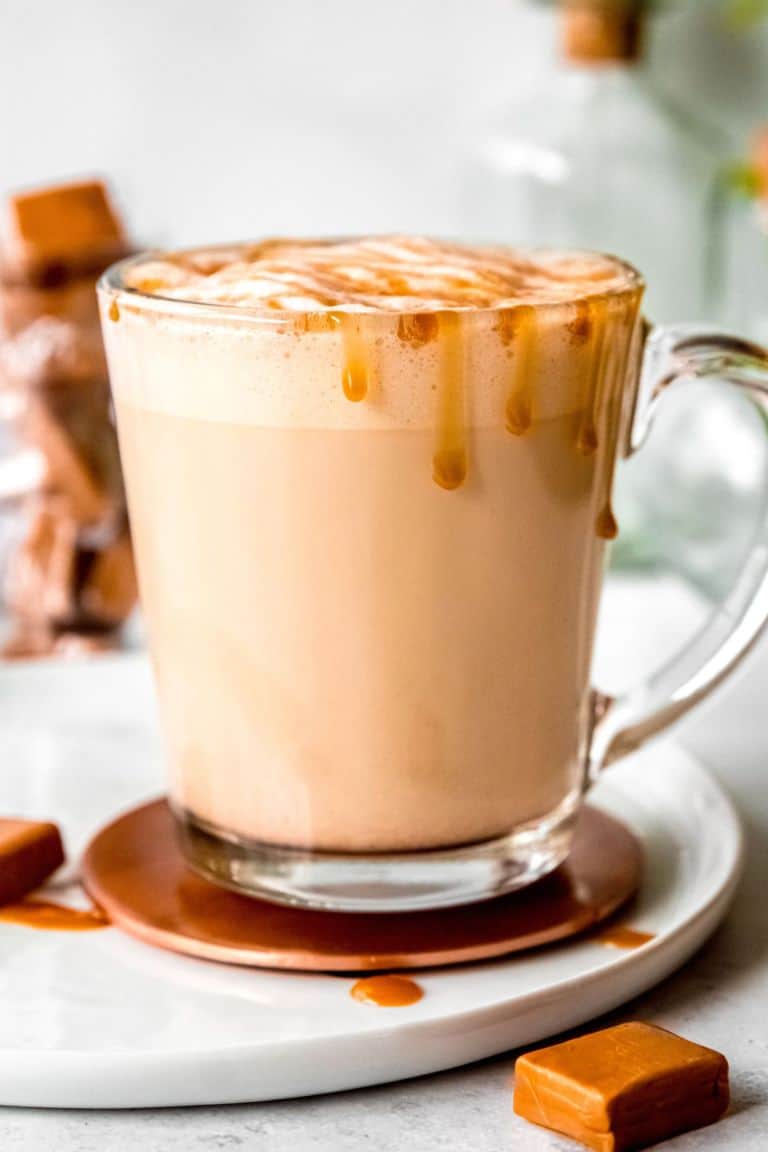 hot caramel latte in glass mug.