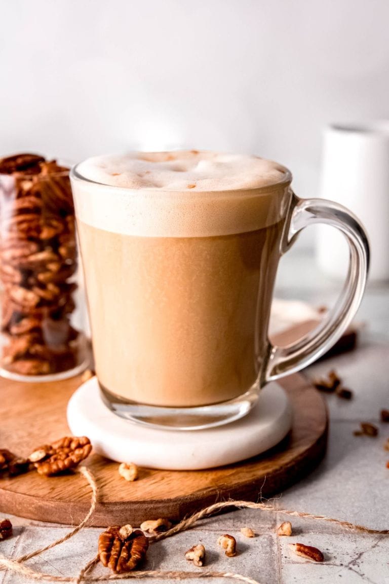 hot pecan crunch latte in glass mug.