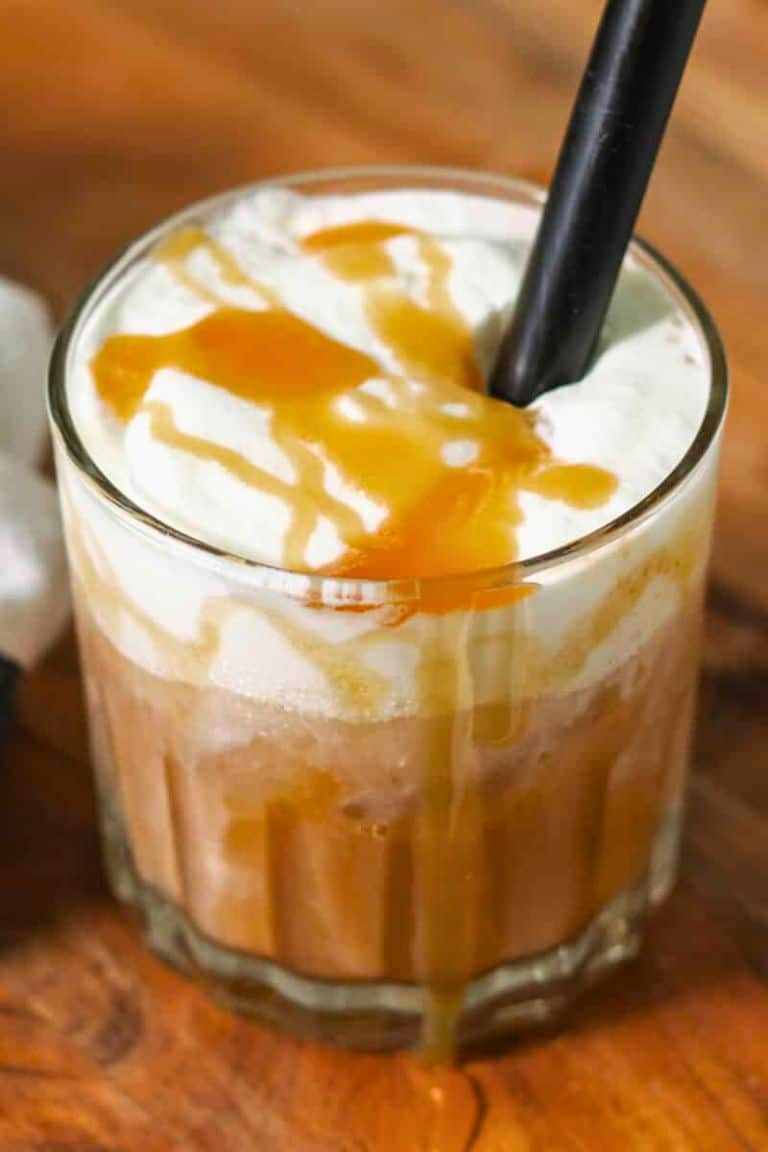 caramel iced latte in glass with straw.