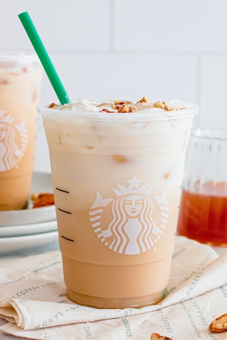 iced pecan crunch oatmilk latte in starbucks cup.