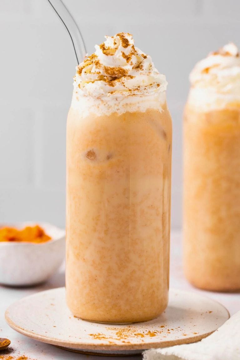 iced pumpkin spice latte with whipped cream.