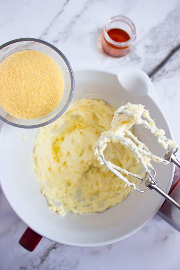 making cheesecake filling in bowl.
