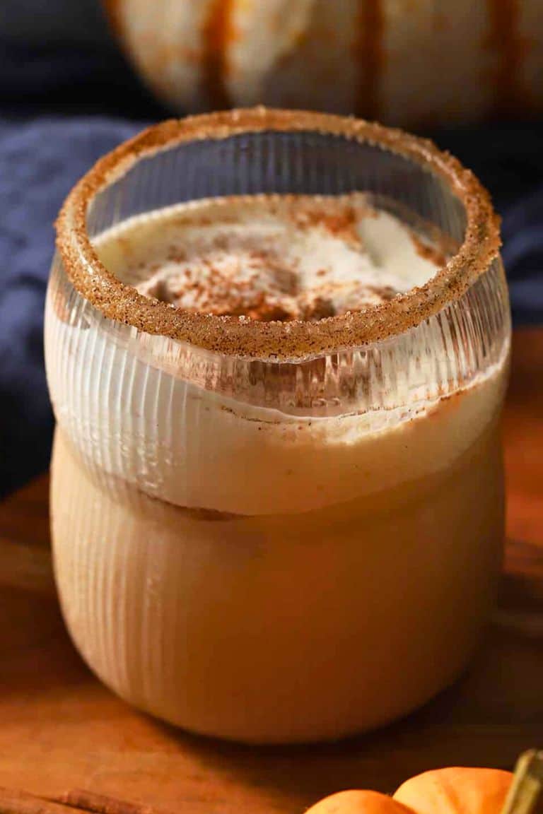 pumpkin white russian cocktail in cinnamon sugar rimmed glass.