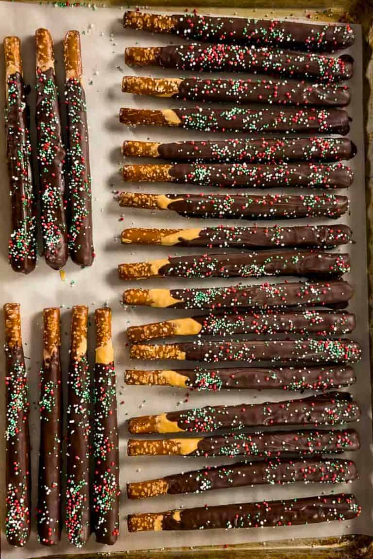 chocolate covered pretzel rods on tray.