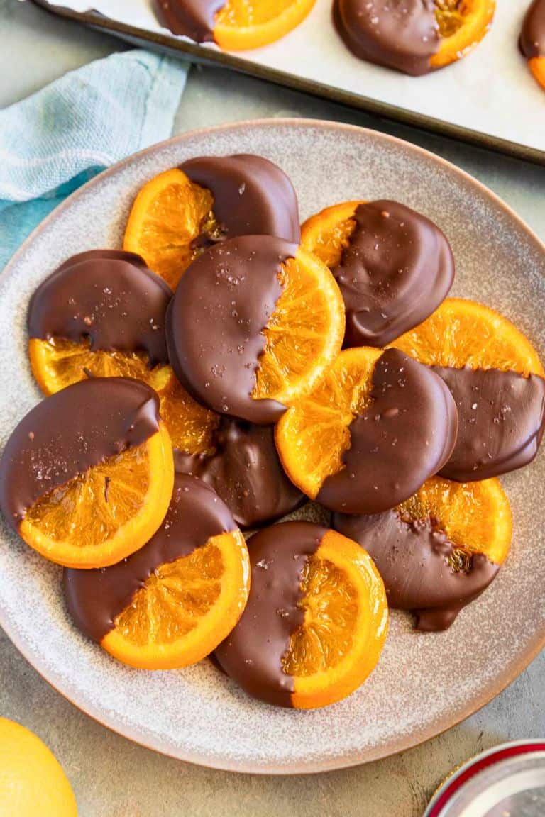 chocolate candied oranges on plate.