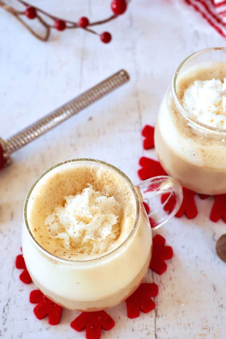 festive eggnog latte in glass mug.