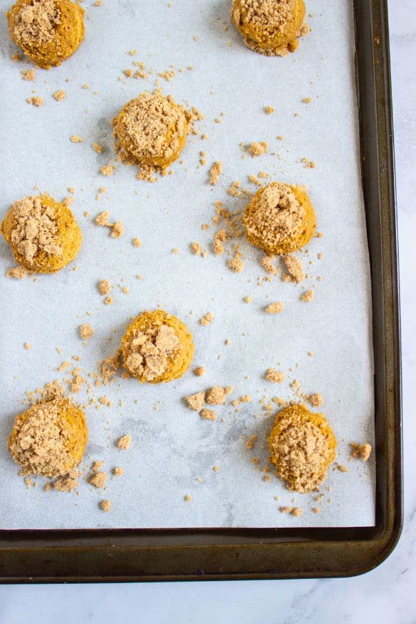 crumble topping on cookies on tray.