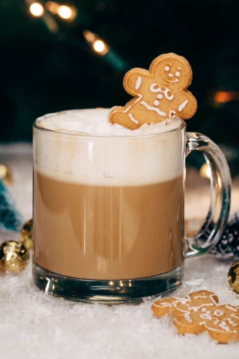 gingerbread flavored christmas coffee with gingerbread man on top.