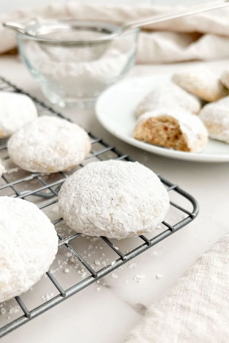 sugar dusted italian cookies on wire rack.
