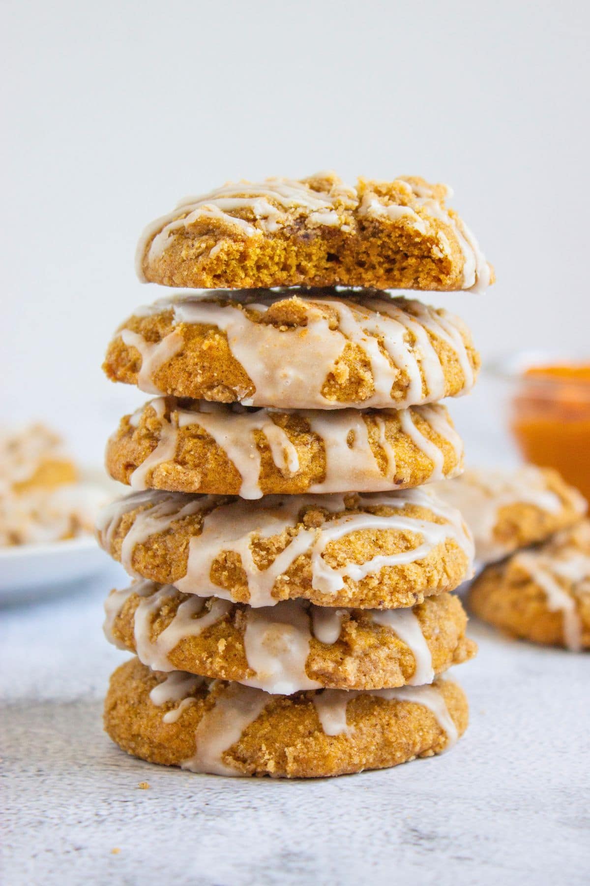 stack of glazed pumpkin coffee cake cookies.