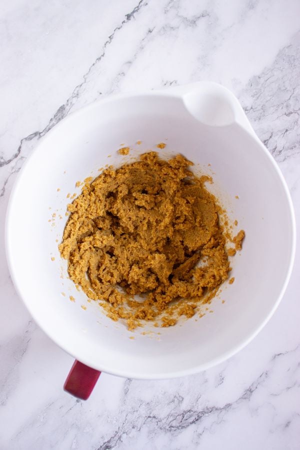 pumpkin cookie creamed butter in bowl.