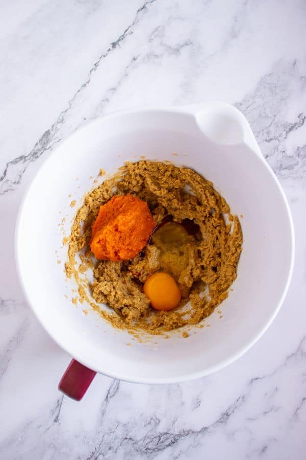 pumpkin cookies wet ingredients in bowl.