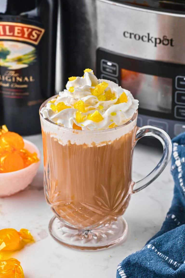 buttered rum hot coffee topped with whipped cream and buttered candies.