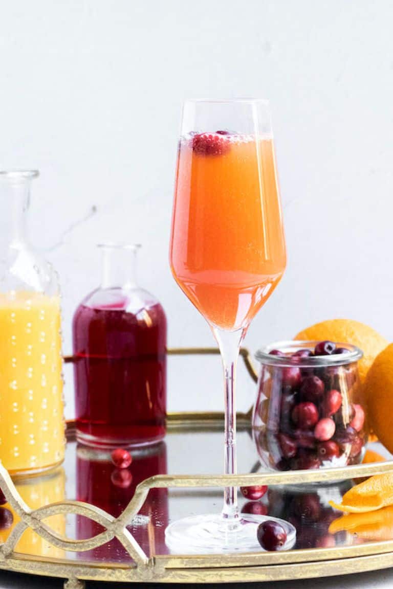 christmas mimosa in champagne glass.