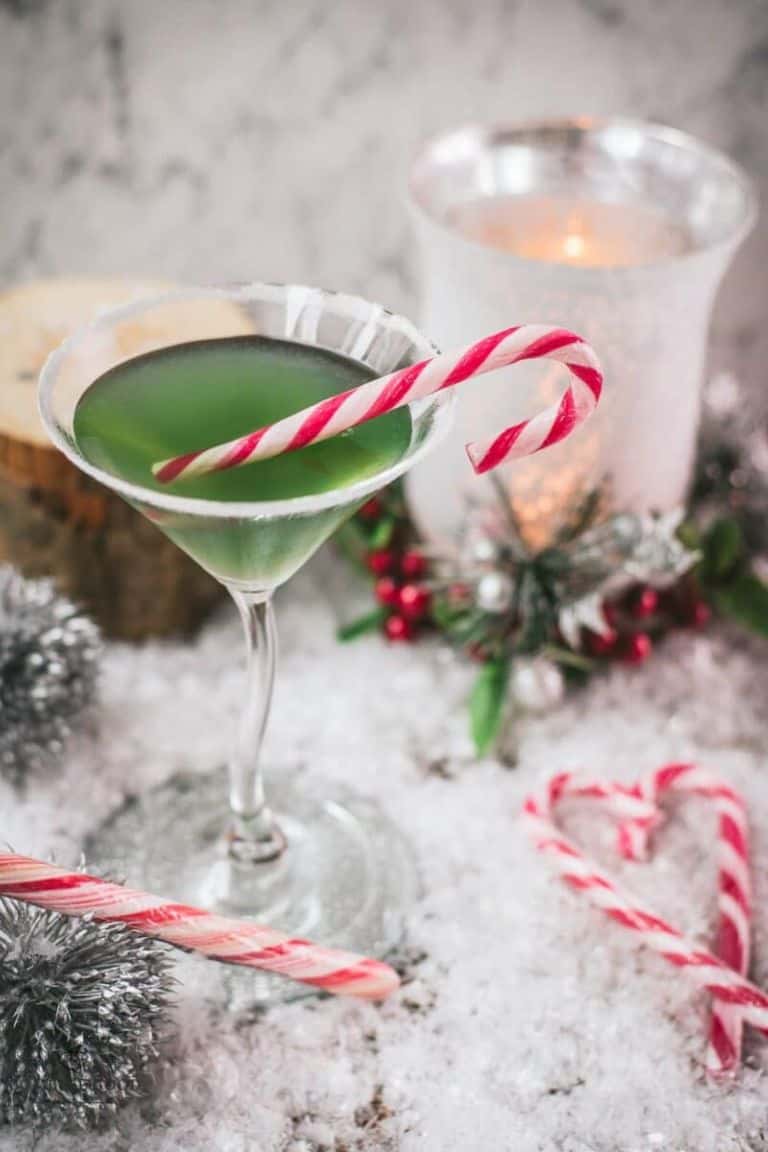 green peppermint cocktail with candy canes.