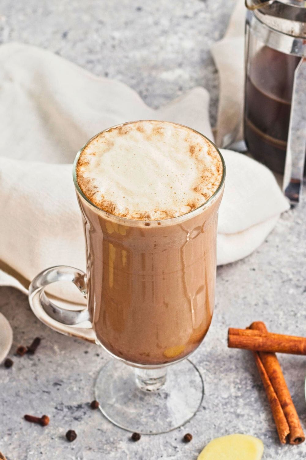 gingerbread latte with ginger syrup in glass mug.