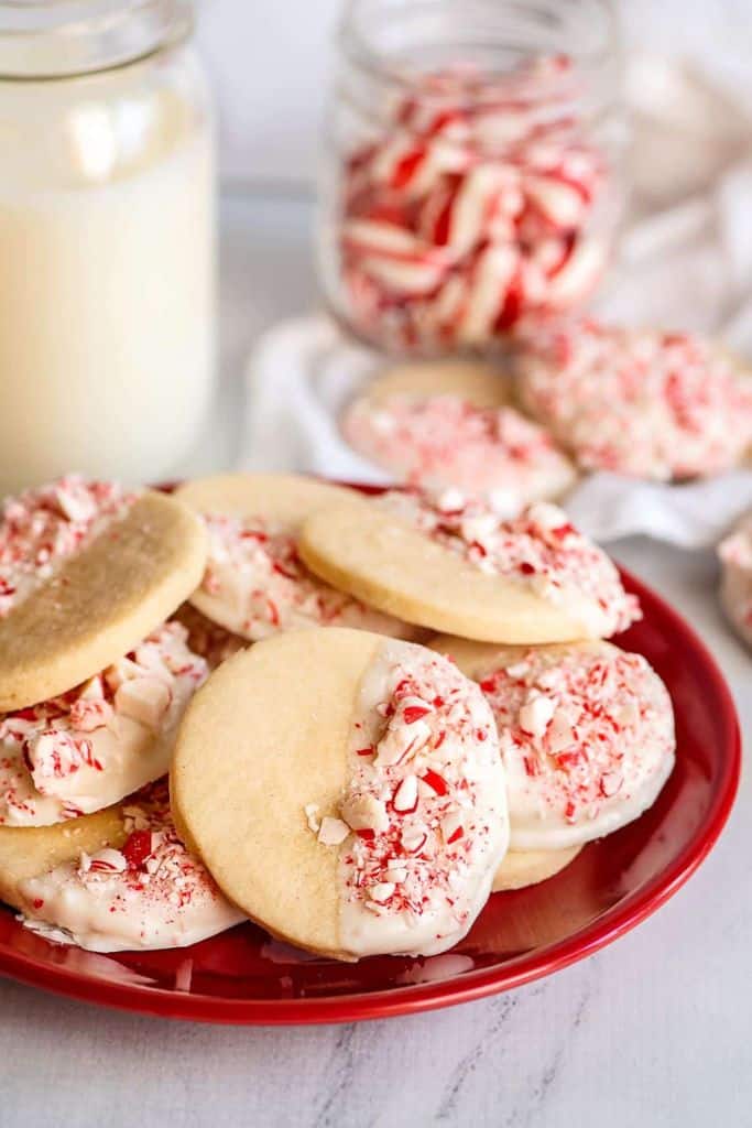 chocolate dipped peppermint butter cookies on plate.