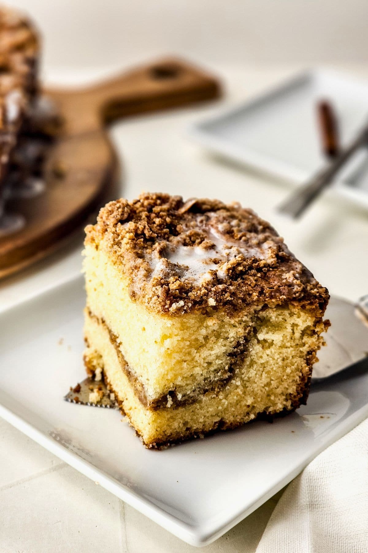 piece of sour cream coffee cake on plate.