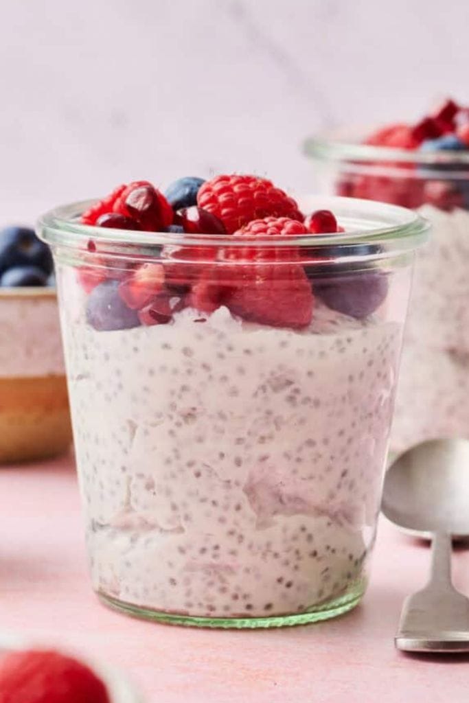 chai parfait in jar with berries.