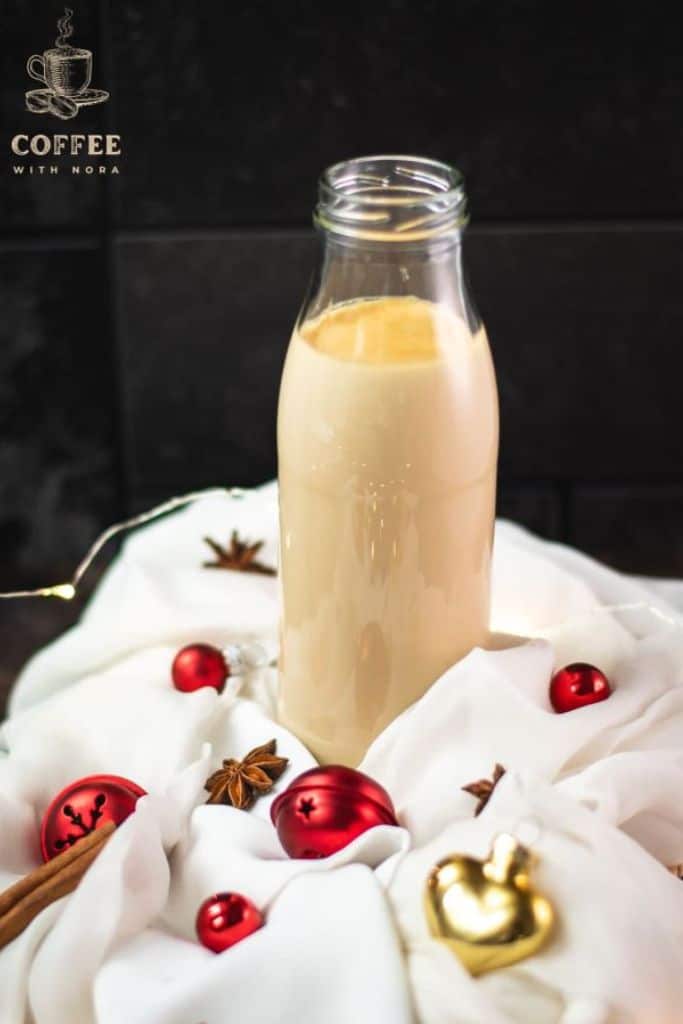 christmas creamer in jar with decorations.