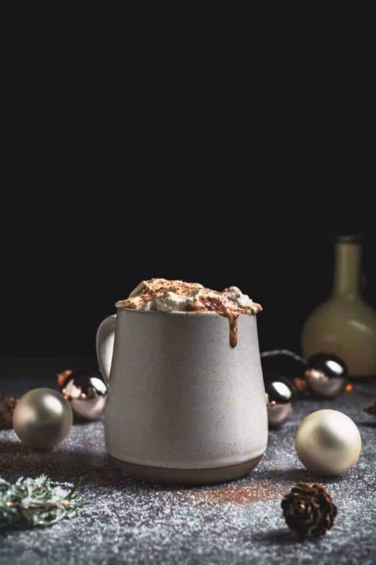 eggnog hot chocolate in mug with cream.