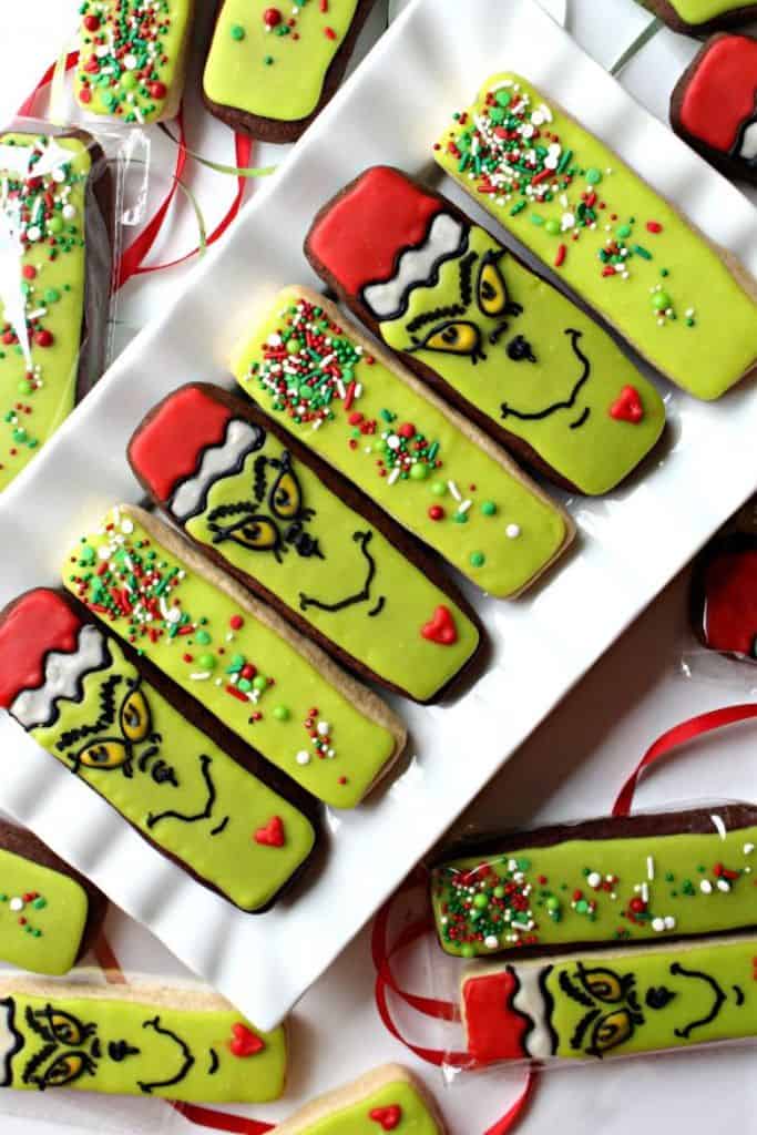 decorated grinch cookies on platter.