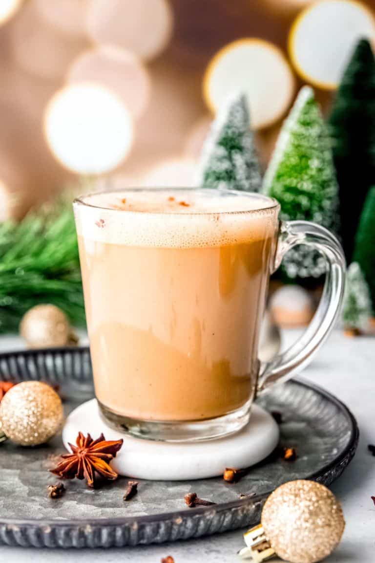 hot eggnog latte in glass mug.