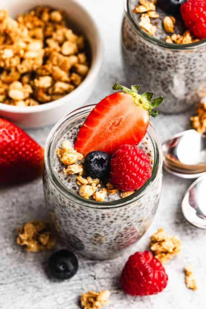 protein chia pudding with berries in jar.