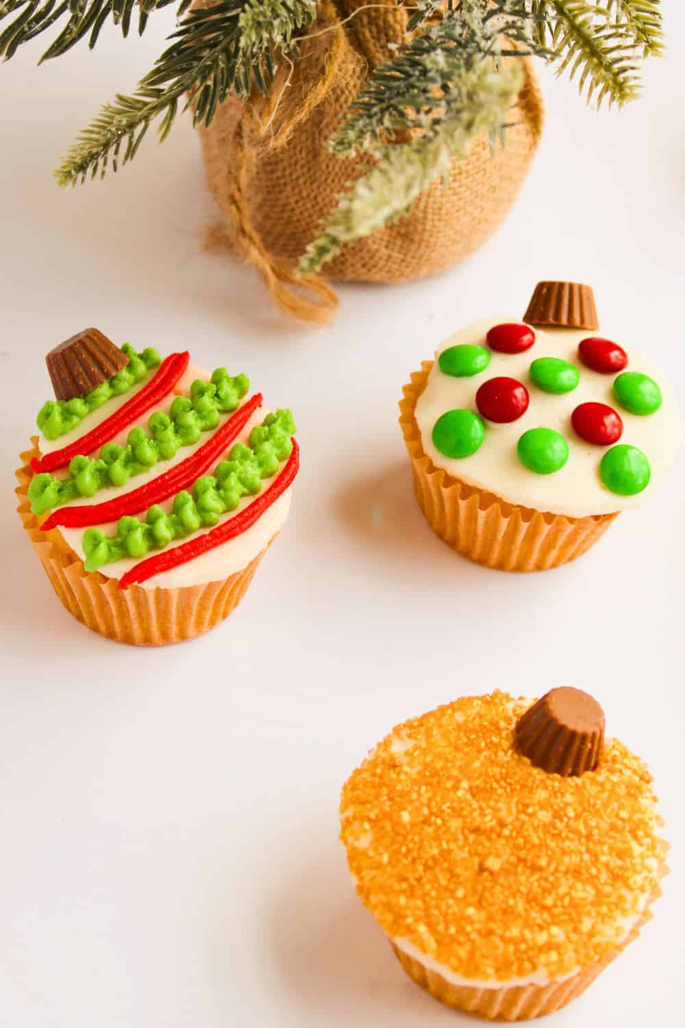 Christmas ornament cupcakes decorated.