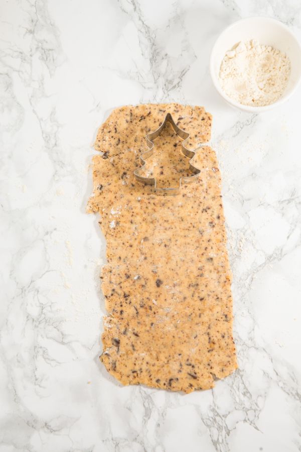 cookie dough rolled with christmas tree cutter.