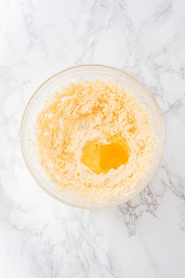 cookie dough with egg in bowl.