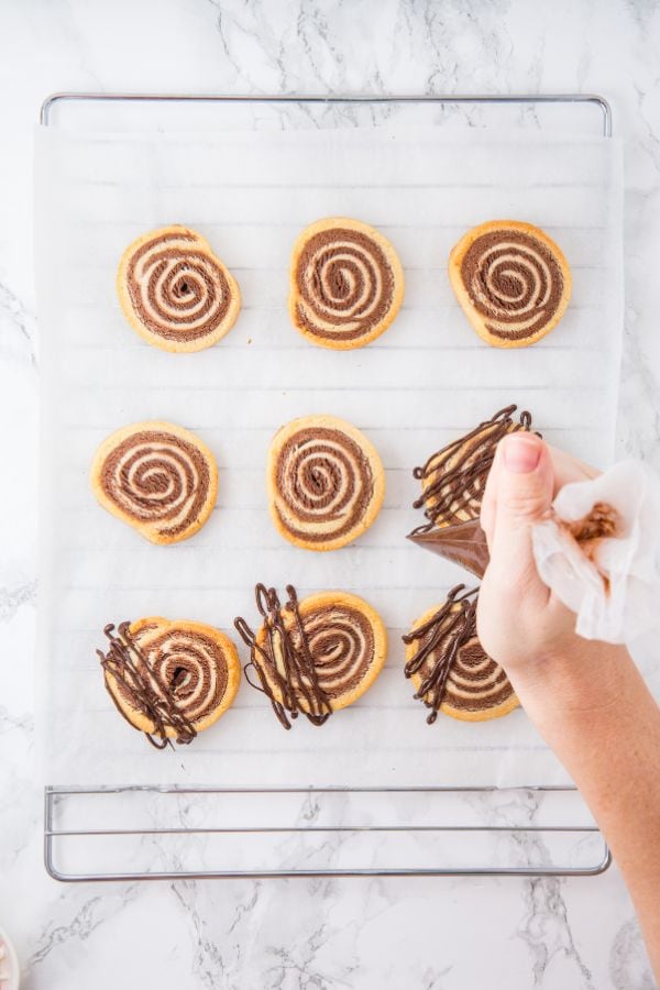 decorating cookies with melted chocolate.
