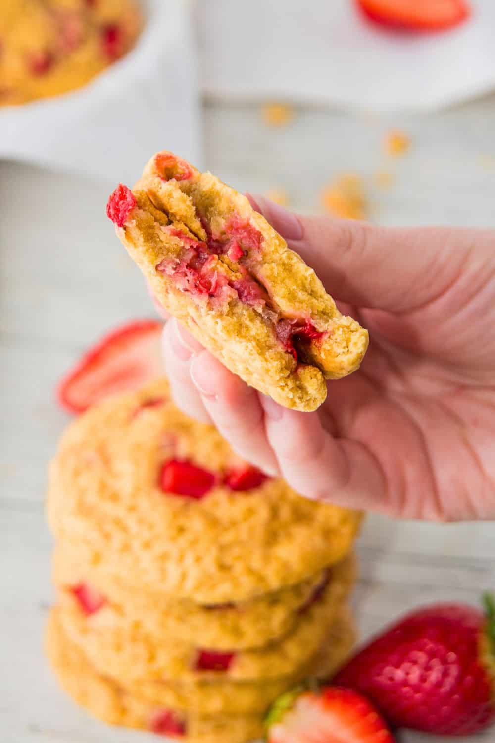 fresh strawberry cookie broken in two.