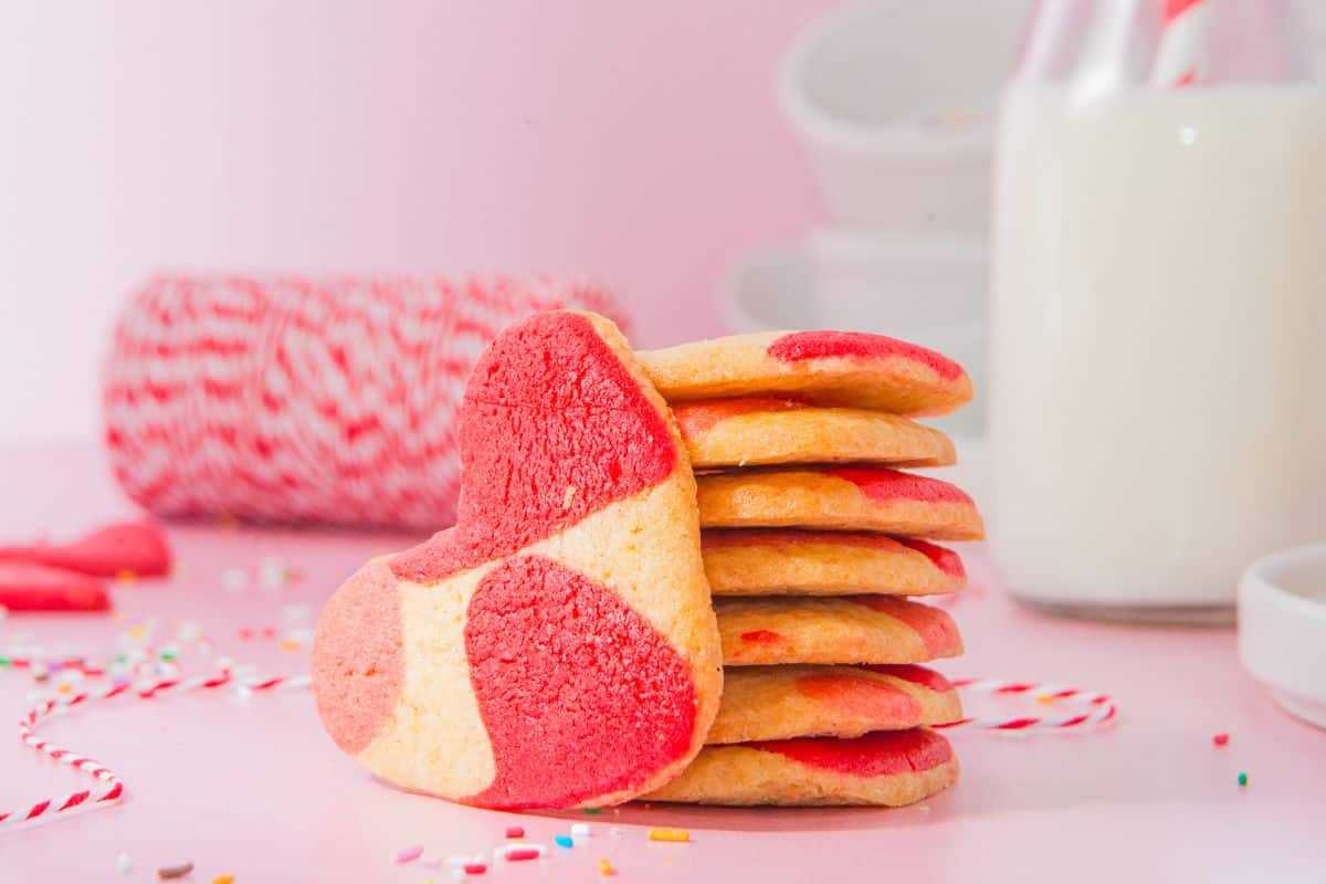 pink heart shaped sugar cookies stacked.