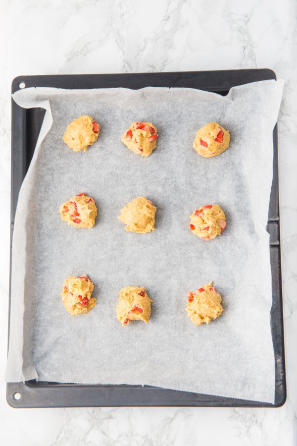 strawberry cookie dough on baking sheet.