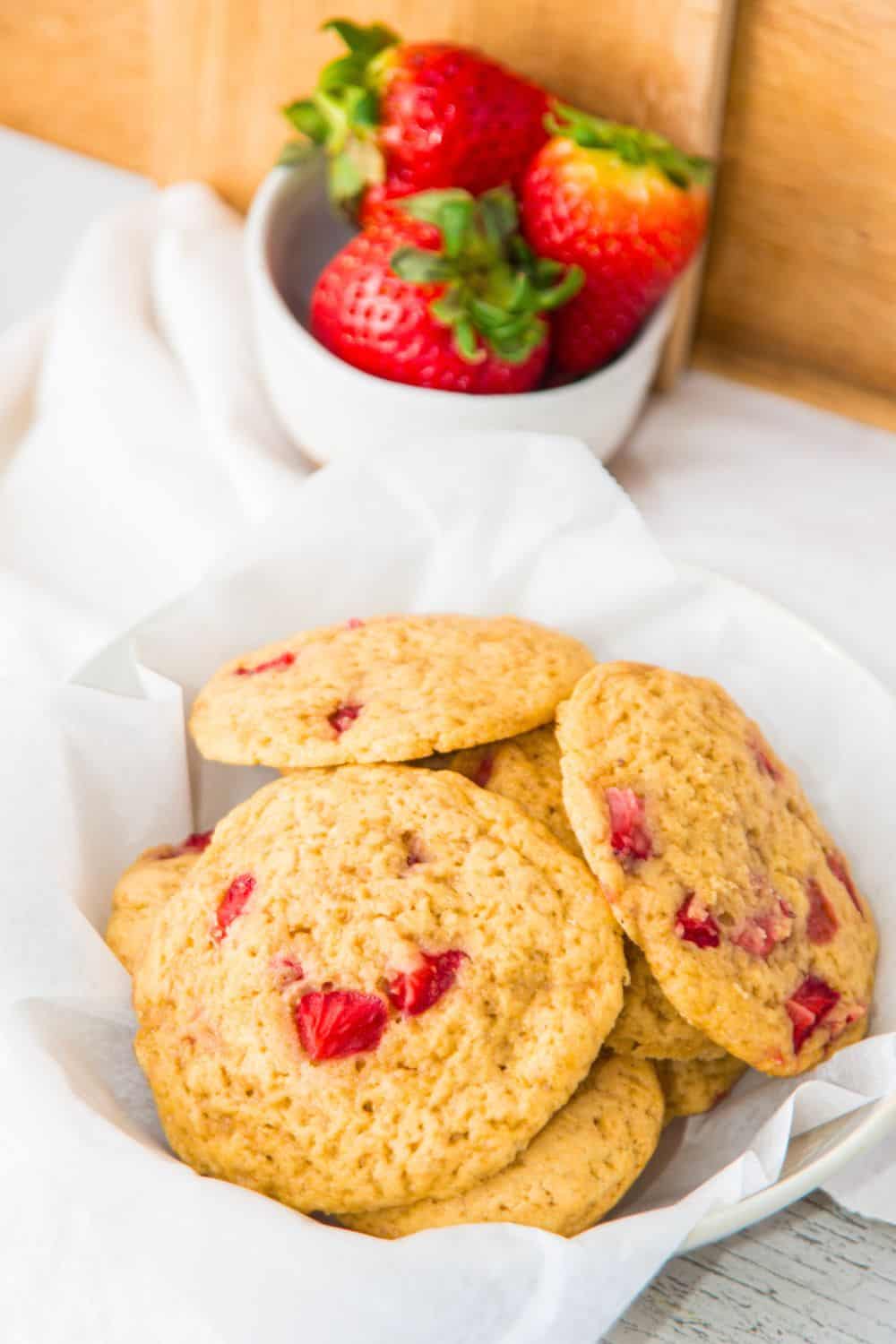 strawberry fruit cookies in white bowl.