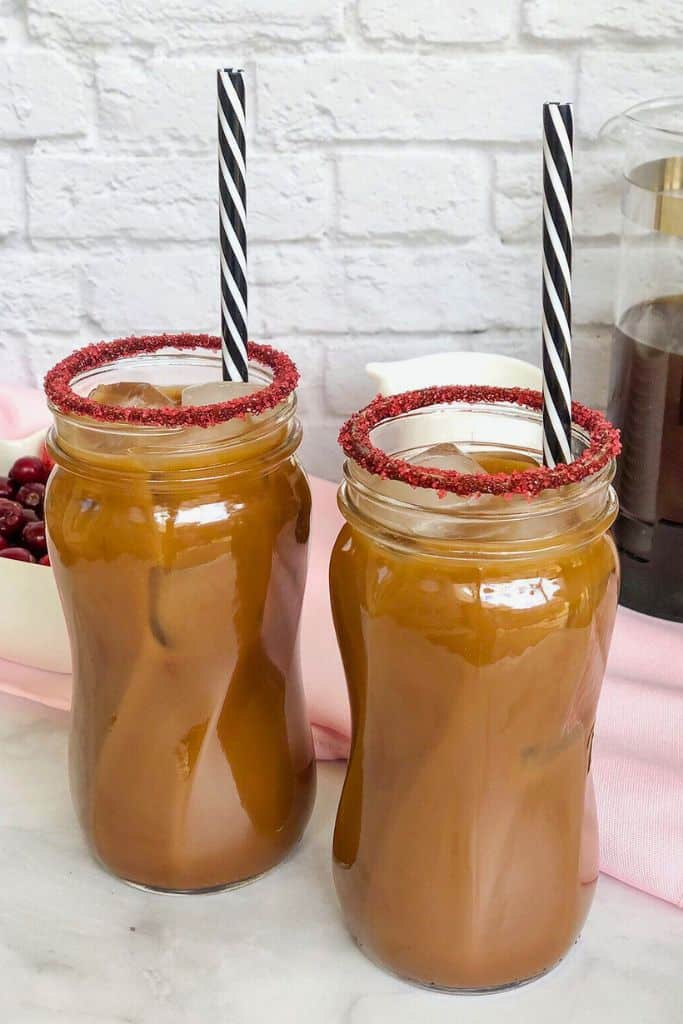 boozy mocha cocktail with red sugar rim.