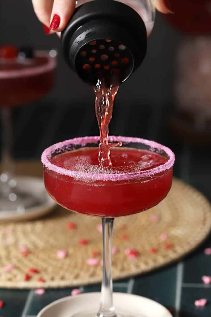 cherry blossom cocktail with pink sugar rim.